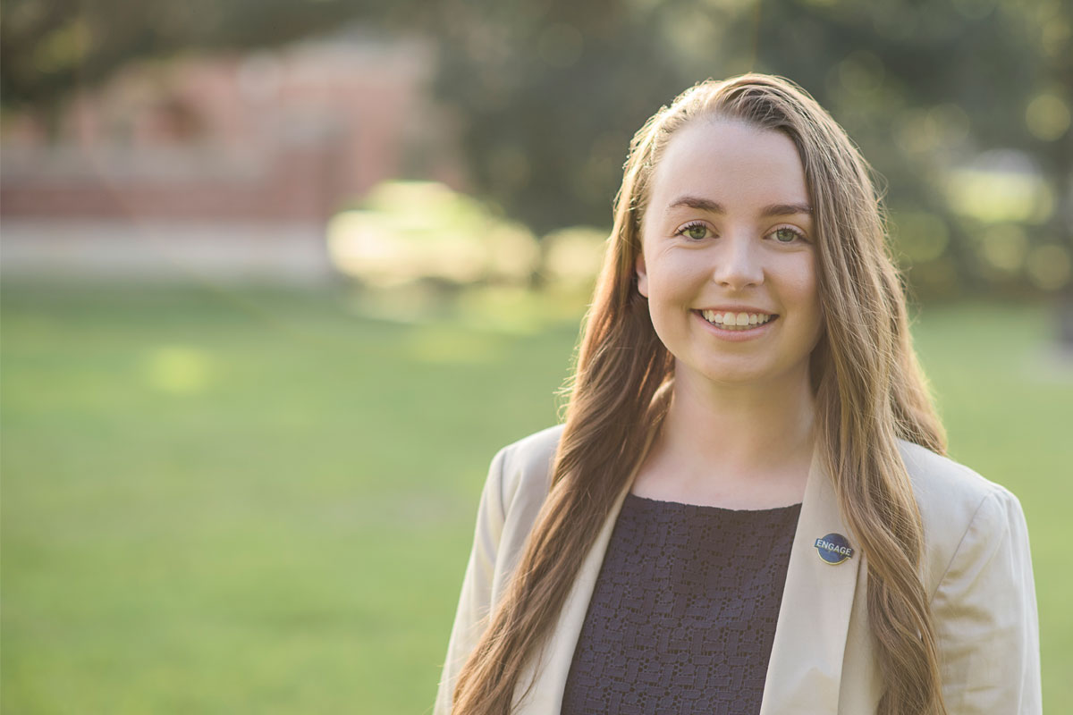 University of Louisiana at Lafayette political science major Rachel Lautigar on campus under oak trees