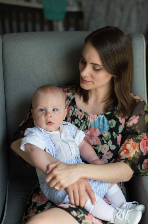 UL Lafayette architecture alum Ashley Bell Davis sits with her son.