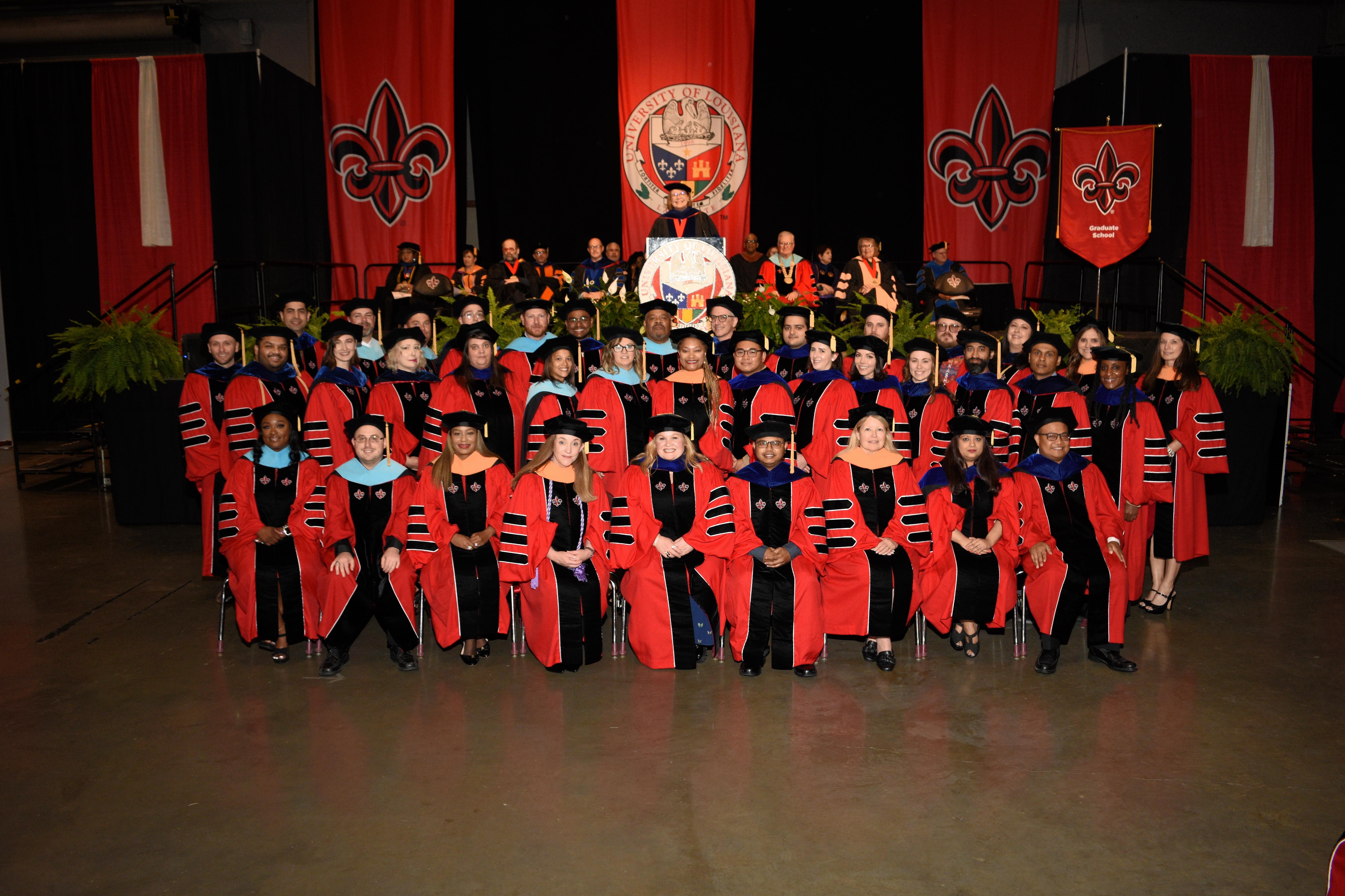 Grad Faculty posing at the 2023 Spring Commencement