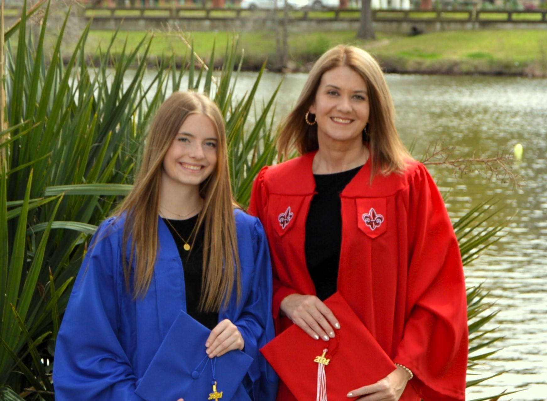 Karen Williams, HSA online graduate, poses with daughter in their caps and gowns.