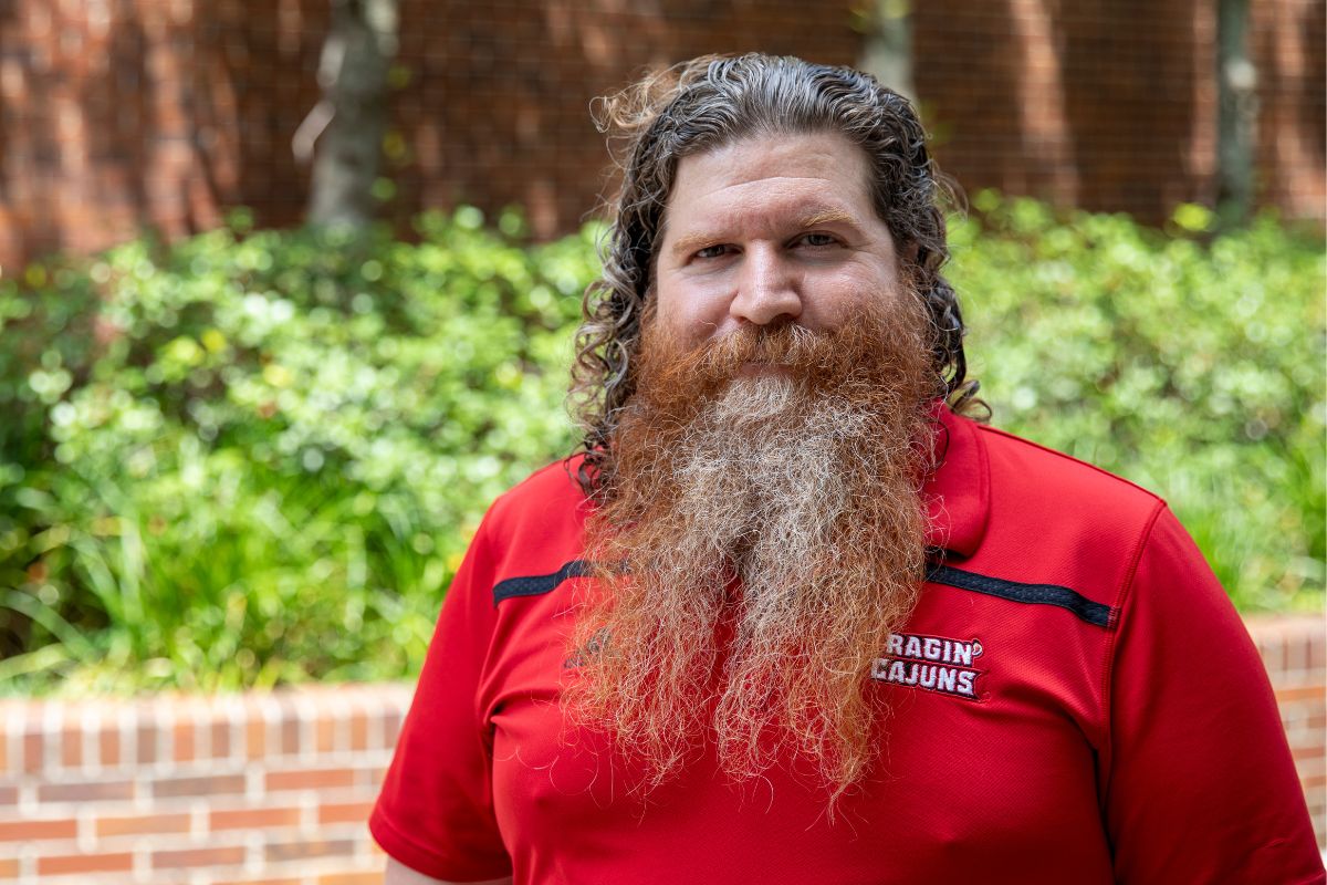 Dr. David Khey, professor and head of the Department of Criminal Justice, looks at the camera and smiles as he poses for a headshot.