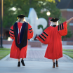 UL Lafayette doctoral graduates walking through the quad in regalia