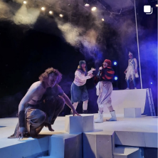 a group of people acting on a stage