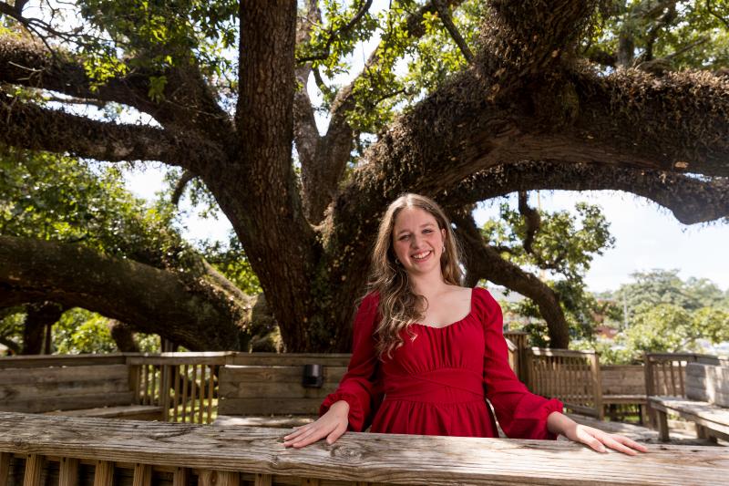 Portrait photo of Brooke Davenport in front of a massive tree