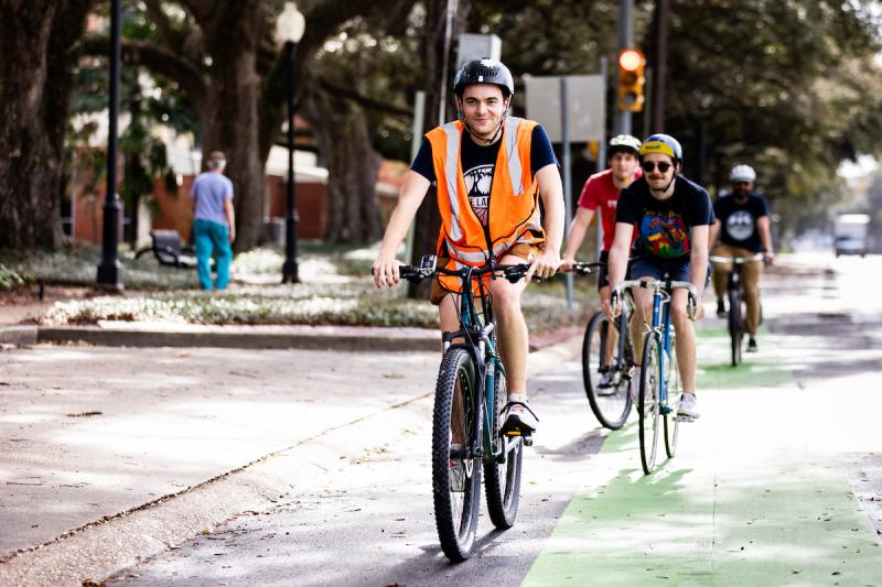 Gabe Griffard bikes down St. Mary Boulevard on the way to Moncus Park.