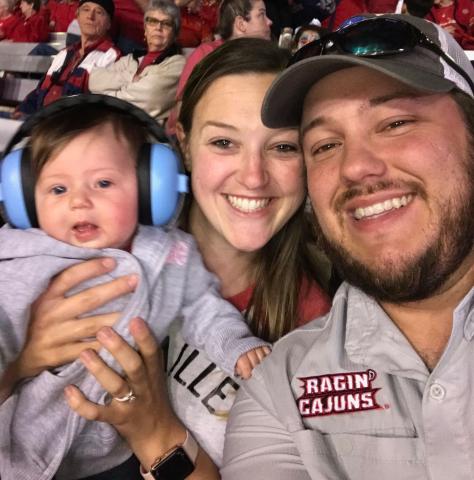 Brian Kidd earned completed his bachelor's degree online in only one semester. Here, Brian and his family pose during a Ragin' Cajuns game.