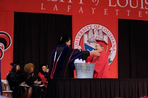 University College Dean Dr. Bobbie DeCuir confers the Bachelor of Science in General Studies to Vicki Vincent-Seaux.