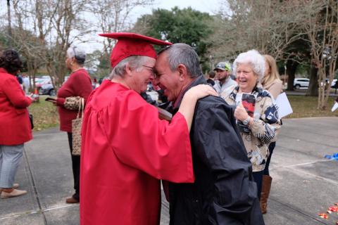 Vicki Vincent-Seaux celebrates with her husband, Danny, after earning her degree through UL Lafayette's online General Studies program.