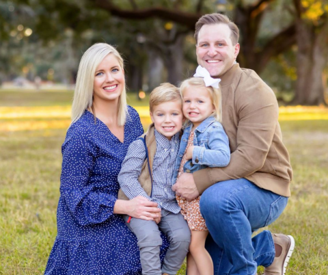 John Gros pictured outdoors with his wife, Mallory, and two young children. Gros earned his degre by studying online at UL Lafayette.